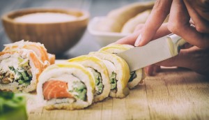 sushi roll process of making raw makki fresh seafood susi - stock image